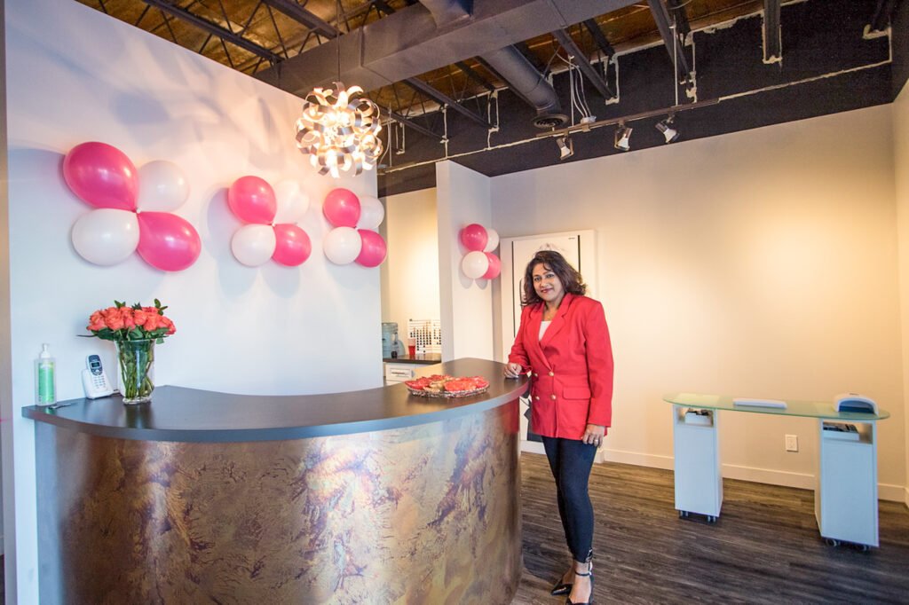 Owner of Ruwis' Beauty Salon standing inside the newly opened salon in Winnipeg