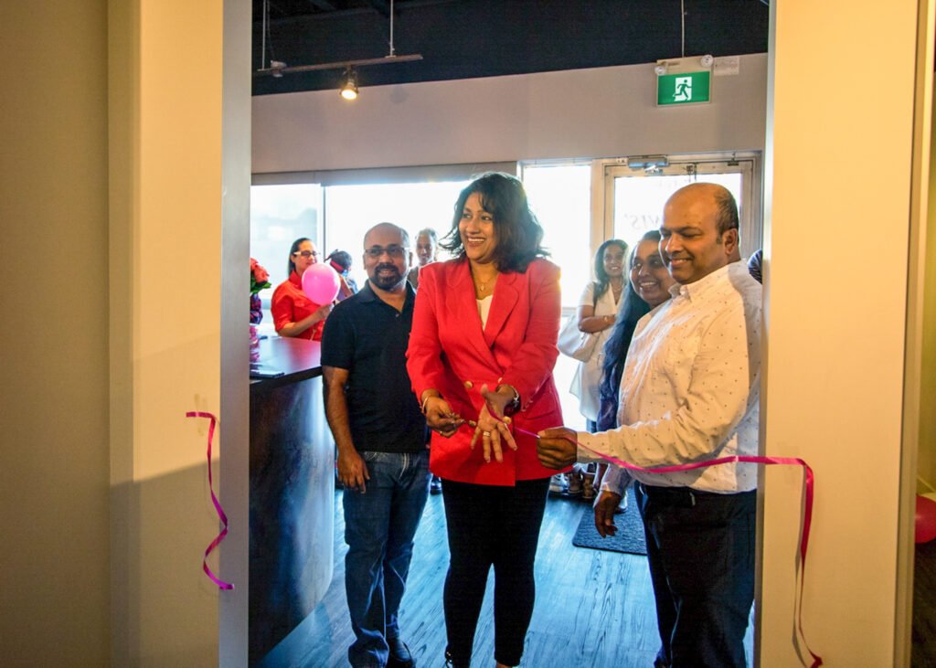 Ribbon cutting ceremony at Ruwis' Hair, Beauty & Nails salon grand opening in Winnipeg