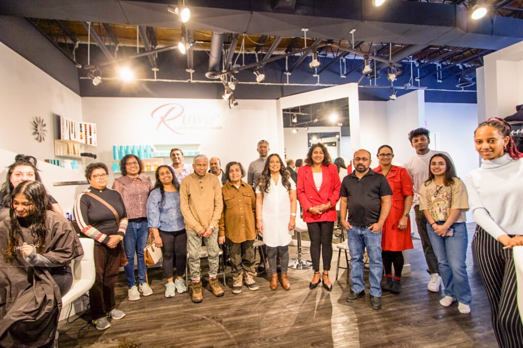  Group photo of guests and team at the grand opening of Ruwis' Beauty Salon in Winnipeg